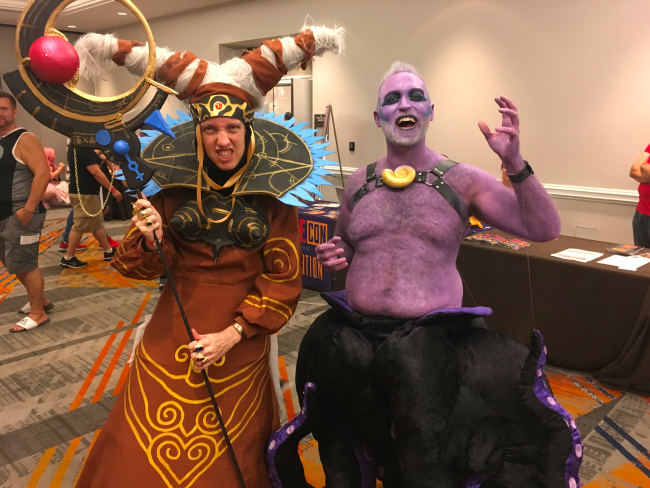Two cosplayers dressed as Rita Repulsa from Power Rangers, and Ursula from the Little Mermaid.